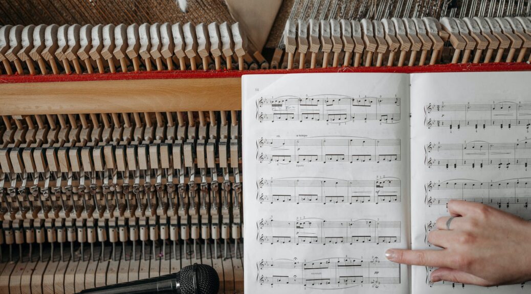 music book on a wooden piano