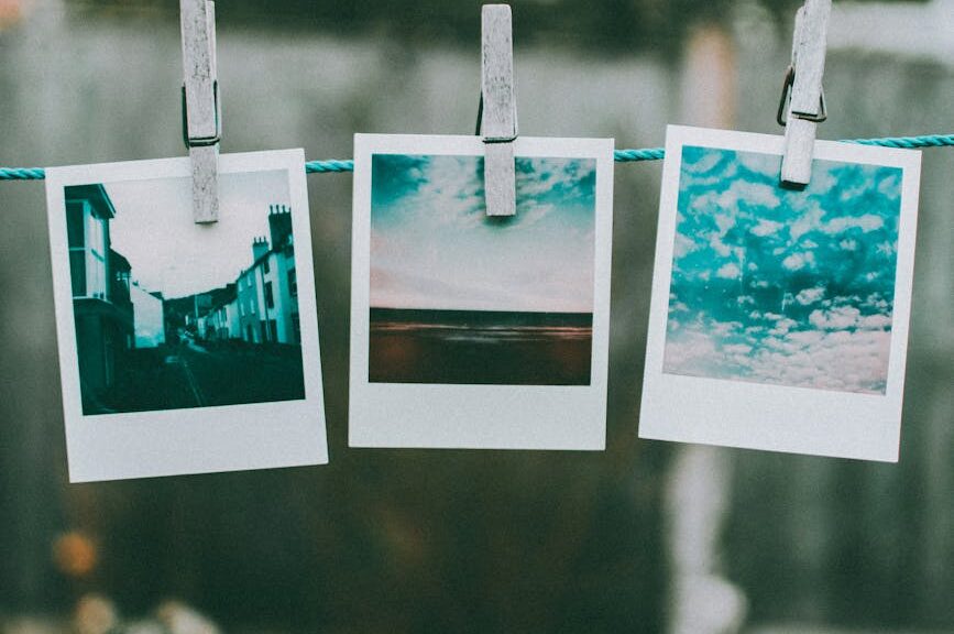 three photos hanged using clothes pin
